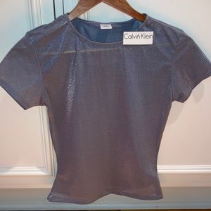 Women’s NWT top. Gray shirt sleeve. Calvin Klein.